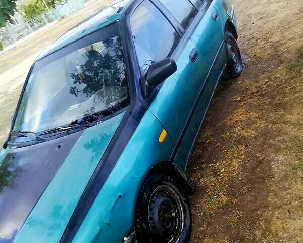 Зелений Ніссан Санні, об'ємом двигуна 1.4 л та пробігом 380 тис. км за 1100 $, фото 7 на Automoto.ua