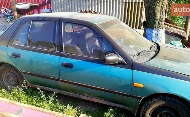 Зелений Ніссан Санні, об'ємом двигуна 1.4 л та пробігом 380 тис. км за 1100 $, фото 1 на Automoto.ua