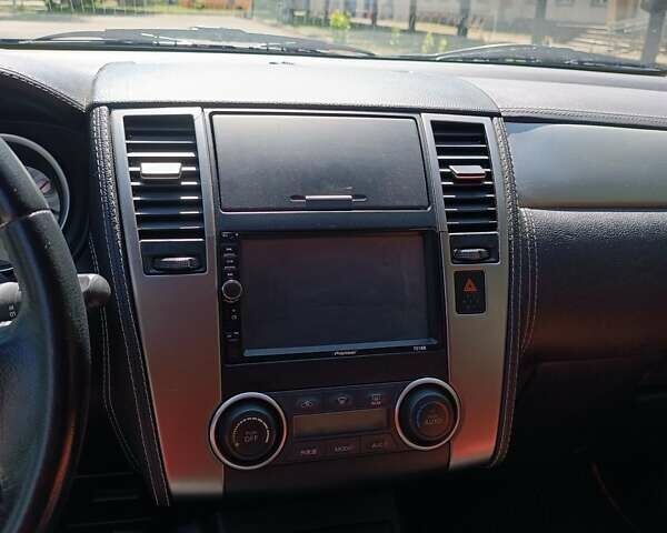 Белый Ниссан Тиида, объемом двигателя 1.5 л и пробегом 96 тыс. км за 7000 $, фото 14 на Automoto.ua