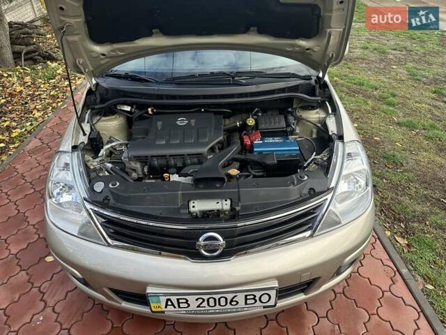 Бежевый Ниссан Тиида, объемом двигателя 1.6 л и пробегом 77 тыс. км за 7650 $, фото 47 на Automoto.ua