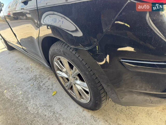 Черный Ниссан Тиида, объемом двигателя 1.6 л и пробегом 195 тыс. км за 5000 $, фото 10 на Automoto.ua