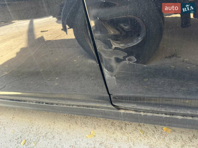 Черный Ниссан Тиида, объемом двигателя 1.6 л и пробегом 195 тыс. км за 5000 $, фото 11 на Automoto.ua