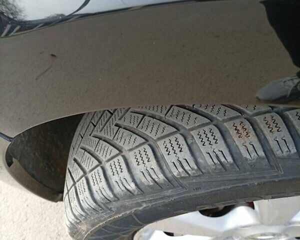 Черный Ниссан Тиида, объемом двигателя 1.6 л и пробегом 240 тыс. км за 7900 $, фото 14 на Automoto.ua