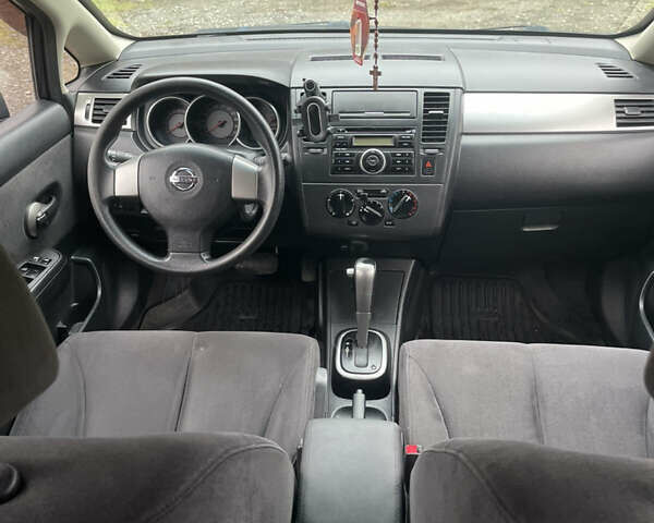 Черный Ниссан Тиида, объемом двигателя 1.6 л и пробегом 138 тыс. км за 6400 $, фото 18 на Automoto.ua