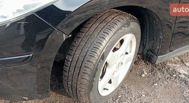 Черный Ниссан Тиида, объемом двигателя 1.6 л и пробегом 300 тыс. км за 4550 $, фото 11 на Automoto.ua