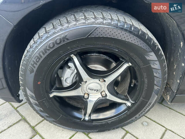 Черный Ниссан Тиида, объемом двигателя 1.6 л и пробегом 169 тыс. км за 6200 $, фото 19 на Automoto.ua