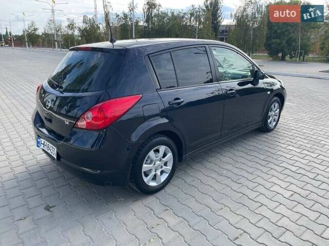 Черный Ниссан Тиида, объемом двигателя 1.6 л и пробегом 229 тыс. км за 6800 $, фото 2 на Automoto.ua