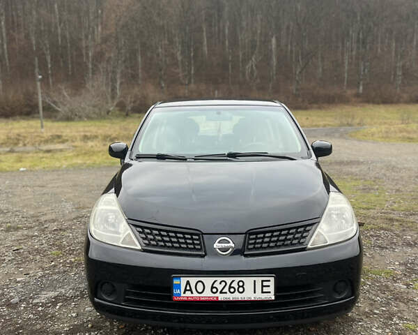 Черный Ниссан Тиида, объемом двигателя 1.6 л и пробегом 138 тыс. км за 6400 $, фото 2 на Automoto.ua