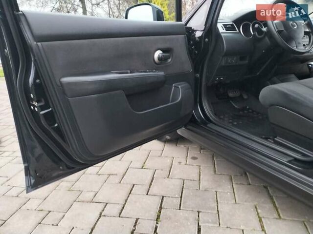 Черный Ниссан Тиида, объемом двигателя 1.6 л и пробегом 114 тыс. км за 6900 $, фото 23 на Automoto.ua
