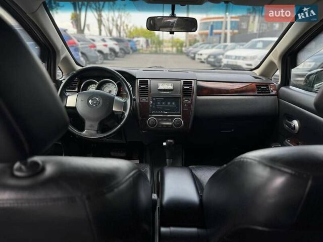 Черный Ниссан Тиида, объемом двигателя 1.49 л и пробегом 152 тыс. км за 8000 $, фото 22 на Automoto.ua