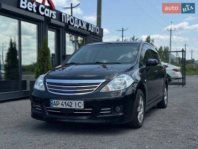 Черный Ниссан Тиида, объемом двигателя 1.49 л и пробегом 152 тыс. км за 8000 $, фото 1 на Automoto.ua