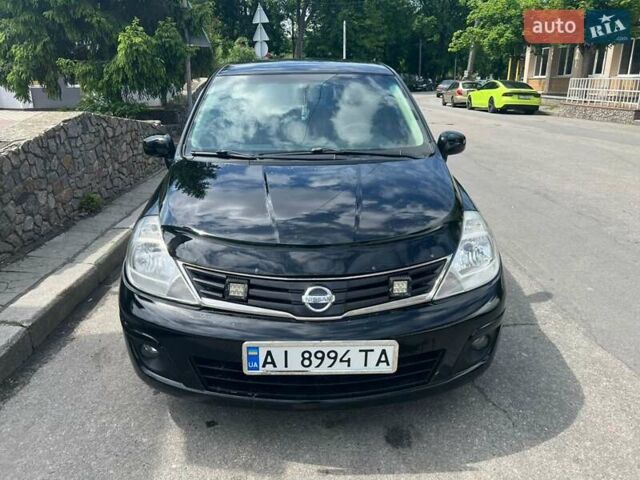 Черный Ниссан Тиида, объемом двигателя 1.6 л и пробегом 237 тыс. км за 6199 $, фото 2 на Automoto.ua