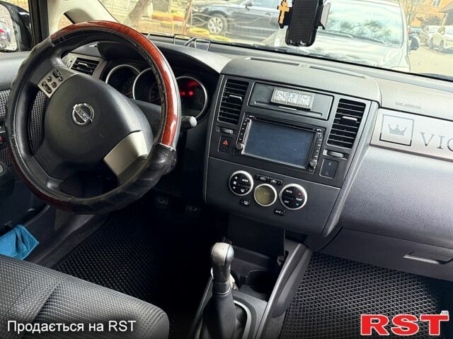 Черный Ниссан Тиида, объемом двигателя 1.6 л и пробегом 155 тыс. км за 5400 $, фото 7 на Automoto.ua