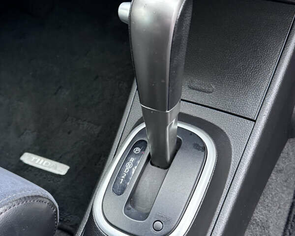 Черный Ниссан Тиида, объемом двигателя 1.5 л и пробегом 95 тыс. км за 8350 $, фото 24 на Automoto.ua