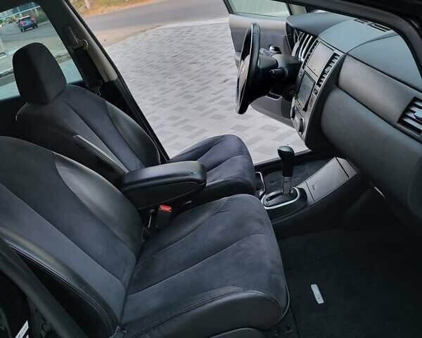 Черный Ниссан Тиида, объемом двигателя 1.5 л и пробегом 95 тыс. км за 8100 $, фото 12 на Automoto.ua