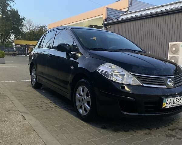 Черный Ниссан Тиида, объемом двигателя 1.6 л и пробегом 200 тыс. км за 4250 $, фото 1 на Automoto.ua
