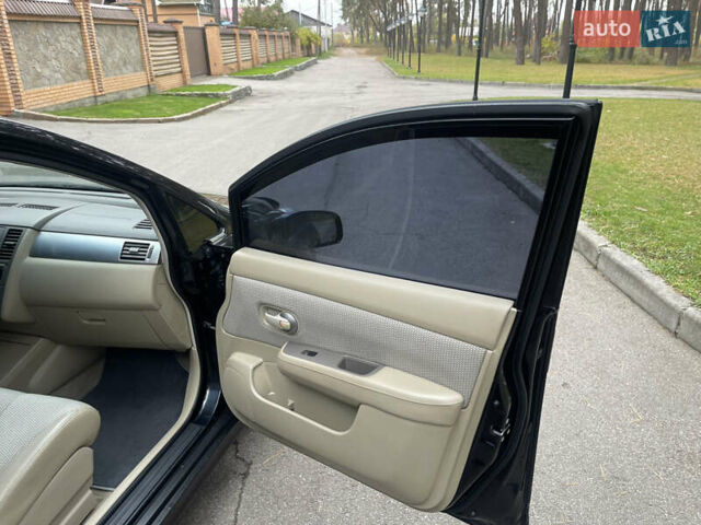 Черный Ниссан Тиида, объемом двигателя 1.6 л и пробегом 188 тыс. км за 5850 $, фото 25 на Automoto.ua