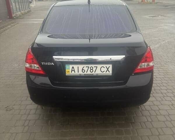 Черный Ниссан Тиида, объемом двигателя 1.6 л и пробегом 150 тыс. км за 5600 $, фото 1 на Automoto.ua