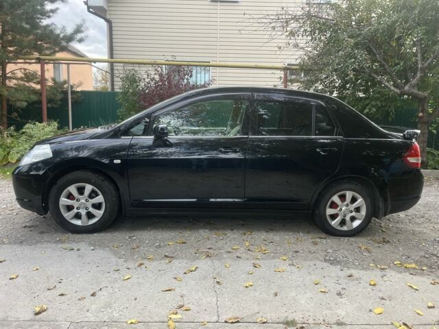 Черный Ниссан Тиида, объемом двигателя 1.6 л и пробегом 304 тыс. км за 4700 $, фото 6 на Automoto.ua