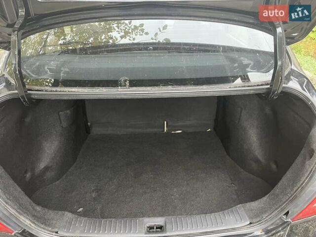 Черный Ниссан Тиида, объемом двигателя 1.6 л и пробегом 304 тыс. км за 4600 $, фото 14 на Automoto.ua