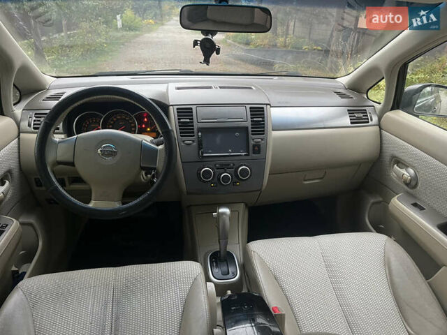 Черный Ниссан Тиида, объемом двигателя 1.6 л и пробегом 304 тыс. км за 4600 $, фото 12 на Automoto.ua