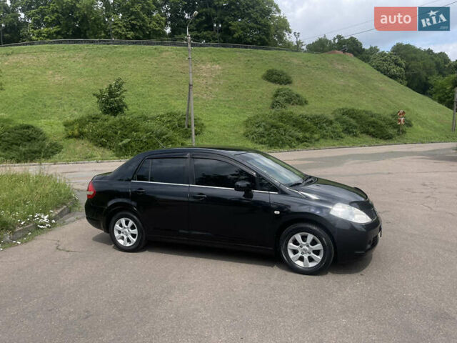 Черный Ниссан Тиида, объемом двигателя 1.6 л и пробегом 187 тыс. км за 5800 $, фото 9 на Automoto.ua