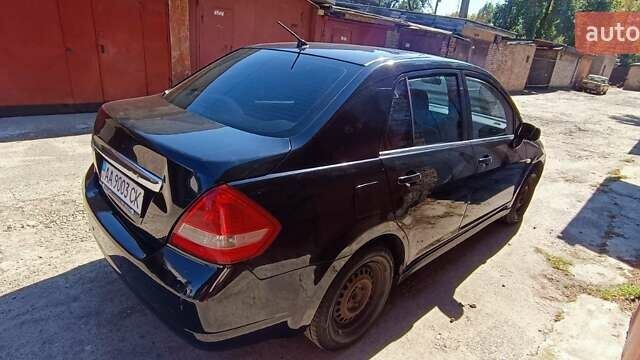 Черный Ниссан Тиида, объемом двигателя 1.6 л и пробегом 210 тыс. км за 3900 $, фото 2 на Automoto.ua