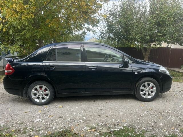 Черный Ниссан Тиида, объемом двигателя 1.6 л и пробегом 304 тыс. км за 4700 $, фото 2 на Automoto.ua