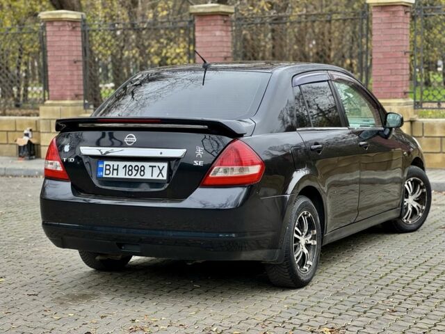 Черный Ниссан Тиида, объемом двигателя 1.6 л и пробегом 130 тыс. км за 4850 $, фото 7 на Automoto.ua