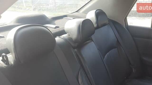 Черный Ниссан Тиида, объемом двигателя 1.8 л и пробегом 270 тыс. км за 2900 $, фото 7 на Automoto.ua
