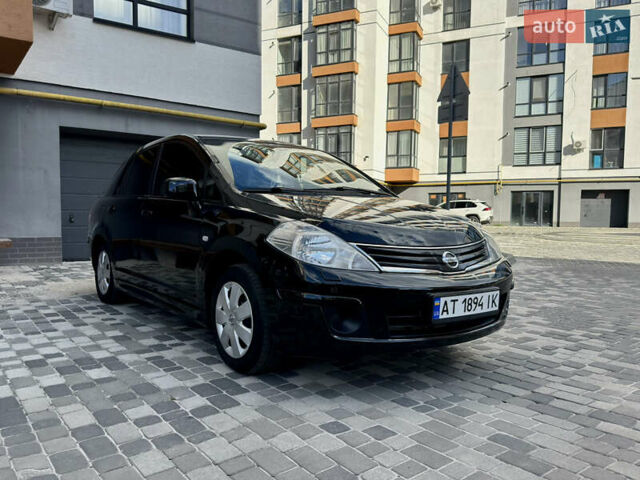 Черный Ниссан Тиида, объемом двигателя 1.6 л и пробегом 192 тыс. км за 5499 $, фото 6 на Automoto.ua