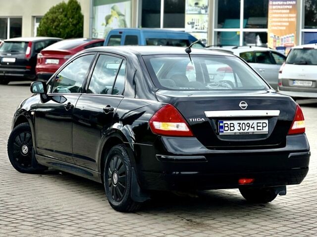 Черный Ниссан Тиида, объемом двигателя 1.6 л и пробегом 170 тыс. км за 4199 $, фото 3 на Automoto.ua
