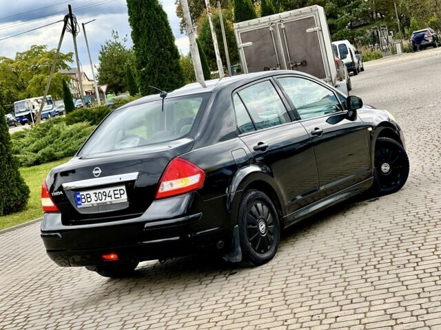 Черный Ниссан Тиида, объемом двигателя 1.6 л и пробегом 170 тыс. км за 4199 $, фото 2 на Automoto.ua