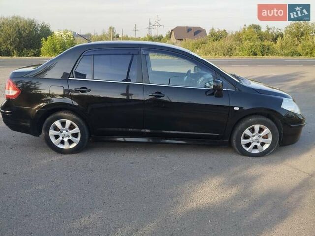 Черный Ниссан Тиида, объемом двигателя 1.8 л и пробегом 110 тыс. км за 6199 $, фото 2 на Automoto.ua