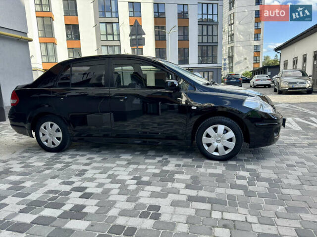 Черный Ниссан Тиида, объемом двигателя 1.6 л и пробегом 192 тыс. км за 5499 $, фото 1 на Automoto.ua