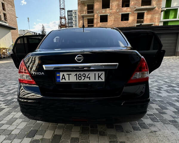 Черный Ниссан Тиида, объемом двигателя 1.6 л и пробегом 192 тыс. км за 5499 $, фото 21 на Automoto.ua