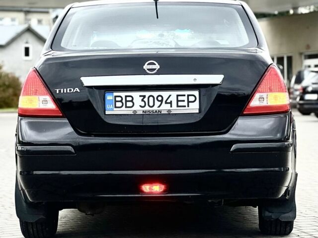 Черный Ниссан Тиида, объемом двигателя 1.6 л и пробегом 170 тыс. км за 4199 $, фото 1 на Automoto.ua