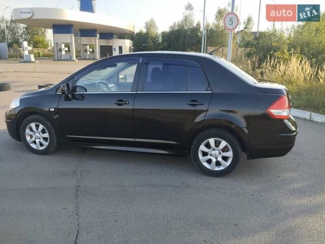 Черный Ниссан Тиида, объемом двигателя 1.8 л и пробегом 110 тыс. км за 6199 $, фото 7 на Automoto.ua