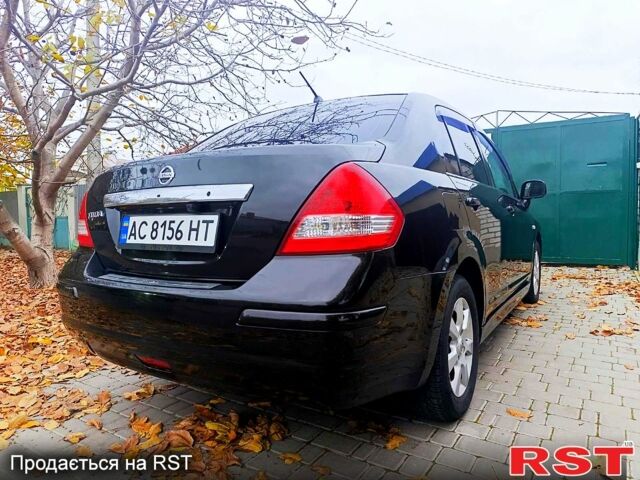 Черный Ниссан Тиида, объемом двигателя 1.8 л и пробегом 110 тыс. км за 5600 $, фото 3 на Automoto.ua