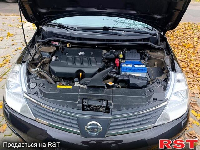 Черный Ниссан Тиида, объемом двигателя 1.8 л и пробегом 110 тыс. км за 5600 $, фото 13 на Automoto.ua