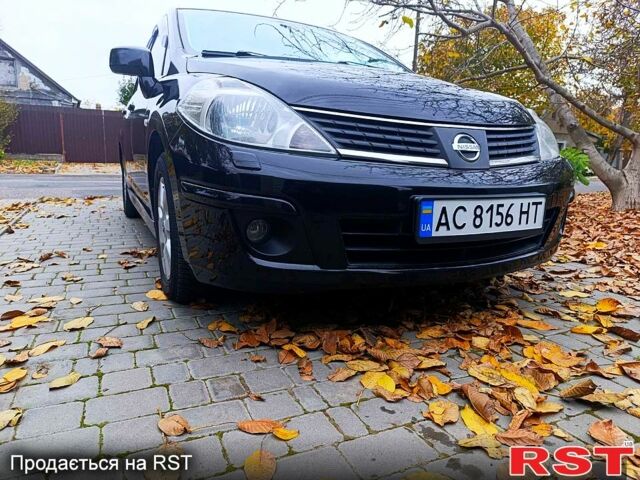Черный Ниссан Тиида, объемом двигателя 1.8 л и пробегом 110 тыс. км за 5600 $, фото 1 на Automoto.ua