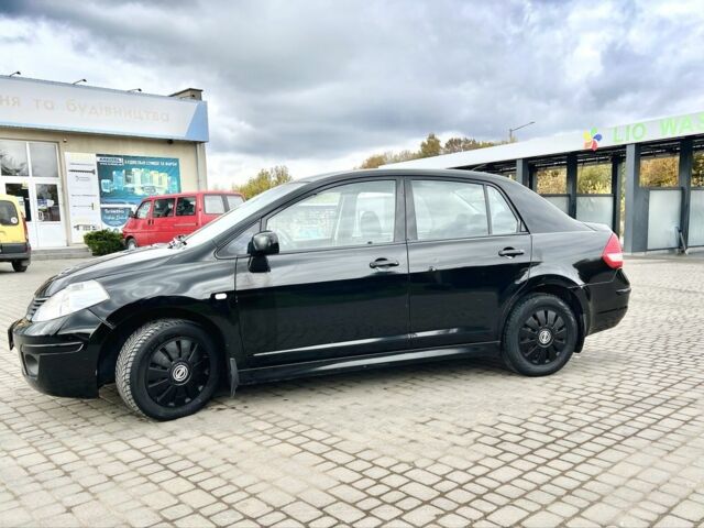 Черный Ниссан Тиида, объемом двигателя 1.6 л и пробегом 170 тыс. км за 4199 $, фото 4 на Automoto.ua