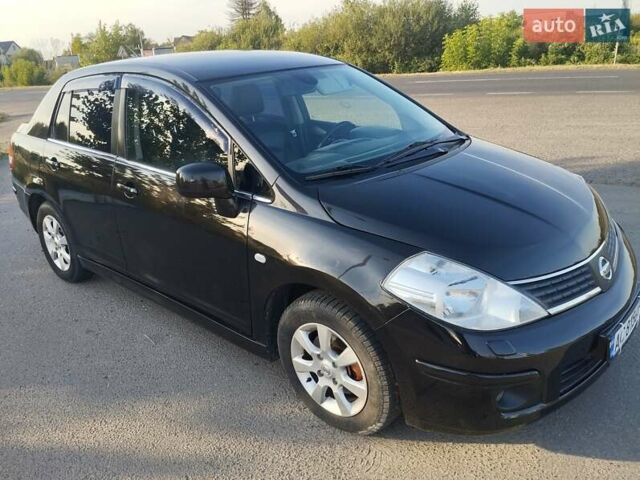 Черный Ниссан Тиида, объемом двигателя 1.8 л и пробегом 110 тыс. км за 6199 $, фото 1 на Automoto.ua