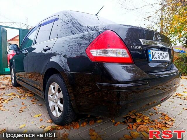Черный Ниссан Тиида, объемом двигателя 1.8 л и пробегом 110 тыс. км за 5600 $, фото 4 на Automoto.ua