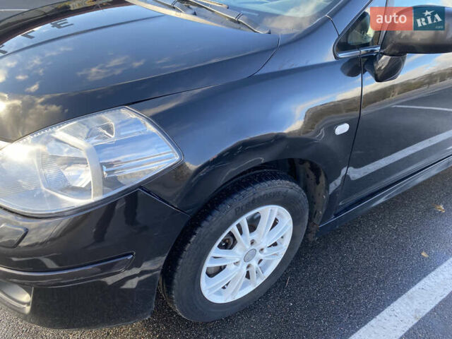 Черный Ниссан Тиида, объемом двигателя 1.6 л и пробегом 138 тыс. км за 7700 $, фото 13 на Automoto.ua
