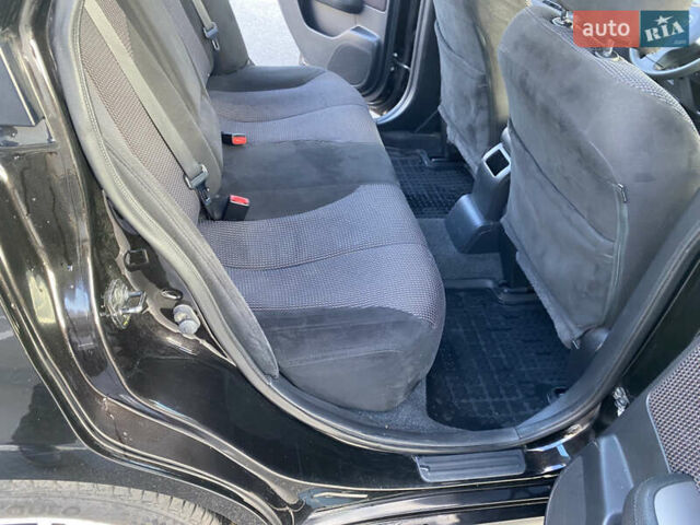 Черный Ниссан Тиида, объемом двигателя 1.6 л и пробегом 138 тыс. км за 7700 $, фото 25 на Automoto.ua