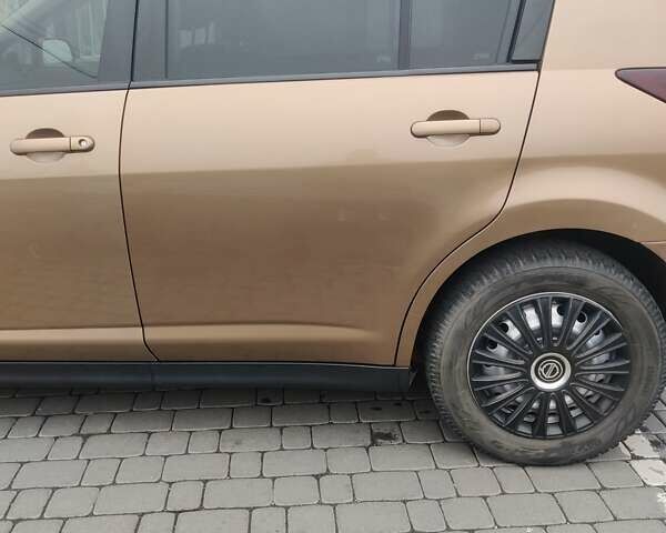 Коричневий Ніссан Тііда, об'ємом двигуна 1.6 л та пробігом 200 тис. км за 6490 $, фото 26 на Automoto.ua