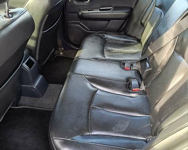 Красный Ниссан Тиида, объемом двигателя 1.8 л и пробегом 175 тыс. км за 5600 $, фото 2 на Automoto.ua