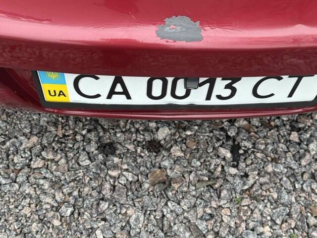 Красный Ниссан Тиида, объемом двигателя 1.6 л и пробегом 145 тыс. км за 5387 $, фото 10 на Automoto.ua