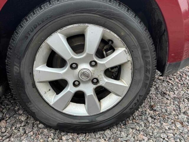 Красный Ниссан Тиида, объемом двигателя 1.6 л и пробегом 145 тыс. км за 5387 $, фото 1 на Automoto.ua